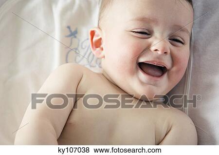 Portrait of a baby laughing View Large Photo Image Stock Photo - Portrait of a baby laughing. Fotosearch