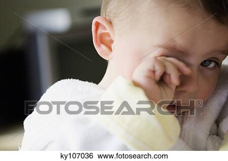 Portrait of a baby tired View Large Photo Image Stock Photograph - Portrait of a baby tired. Fotosearch
