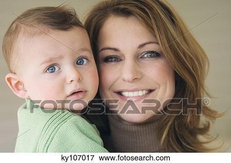 Portrait of mother and baby View Large Photo Image Stock Photo - Portrait of mother and baby. Fotosearch