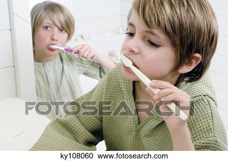 2 boys brushing their teeth View Large Photo Image Stock Image - 2 boys brushing their teeth. Fotosearch