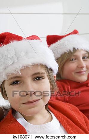 2 boys disguised as Santa Claus View Large Photo Image Stock Image - 2 boys disguised as Santa Claus. Fotosearch