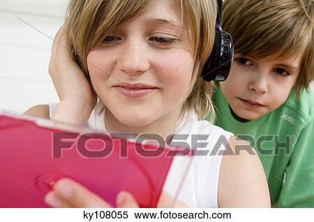 2 boys with headphones, holding CD box View Large Photo Image Stock Photography - 2 boys with headphones, holding CD box. Fotosearch