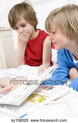 2 children reading View Large Photo Image Stock Photo - 2 children reading. Fotosearch