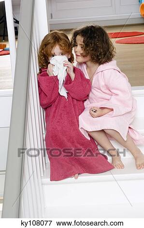 2 little girls in bathrobes, sitting on stairs View Large Photo Image Stock Photo - 2 little girls in bathrobes, sitting on stairs. Fotosearch