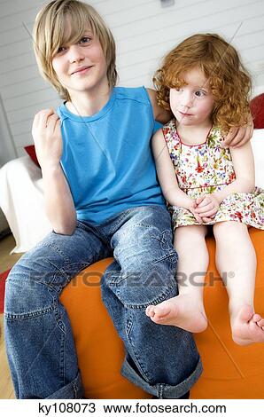 Boy and little girl sitting View Large Photo Image Stock Image - Boy and little girl sitting. Fotosearch