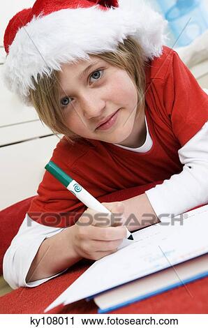 Boy disguised as Santa Claus, writing View Large Photo Image Stock Image - Boy disguised as Santa Claus, writing. Fotosearch