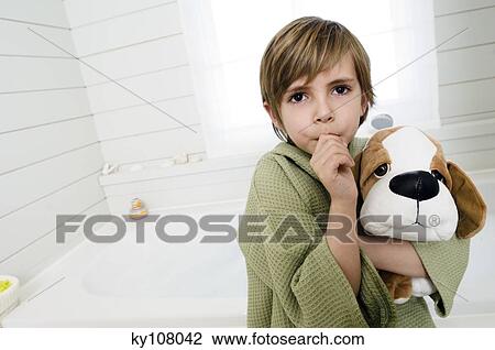 Little boy sucking his thumb, holding stuffed dog View Large Photo Image Stock Image - Little boy sucking his thumb, holding stuffed dog. Fotosearch
