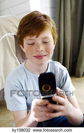 Little boy with mobile phone View Large Photo Image Stock Image - Little boy with mobile phone. Fotosearch
