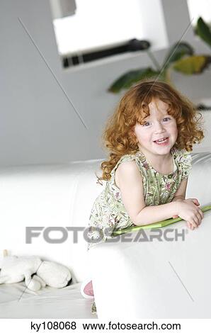 Little girl at home View Large Photo Image Stock Photo - Little girl at home. Fotosearch