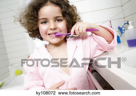 Little girl brushing her teeth View Large Photo Image Stock Image - Little girl brushing her teeth. Fotosearch