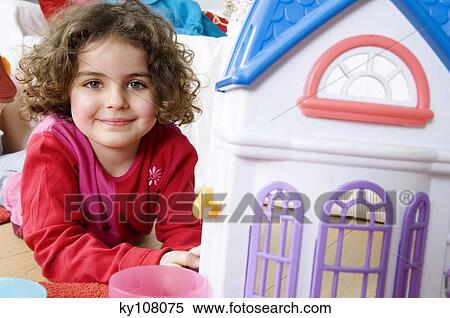Little girl playing View Large Photo Image Stock Photography - Little girl playing. Fotosearch