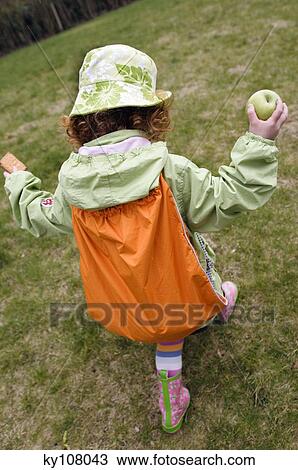 Little girl walking in garden, rear view View Large Photo Image Stock Image - Little girl walking in garden, rear view. Fotosearch