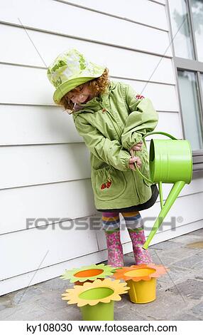 Little girl with watering can View Large Photo Image Stock Image - Little girl with watering can. Fotosearch