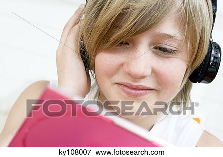 Stock Photo - Portrait of a little boy with headphones. Fotosearch