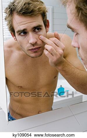 Barechested man in front of bathroom mirror View Large Photo Image Picture - Barechested man in front of bathroom mirror. Fotosearch