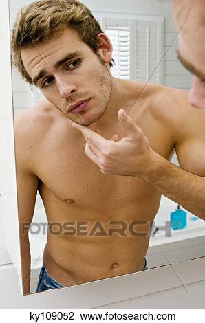 Barechested man in front of bathroom mirror View Large Photo Image Stock Image - Barechested man in front of bathroom mirror. Fotosearch