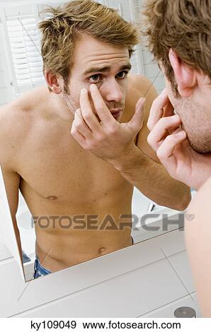 Barechested man in front of bathroom mirror View Large Photo Image Stock Photo - Barechested man in front of bathroom mirror. Fotosearch