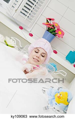 Young woman having a bath View Large Photo Image Stock Image - Young woman having a bath. Fotosearch