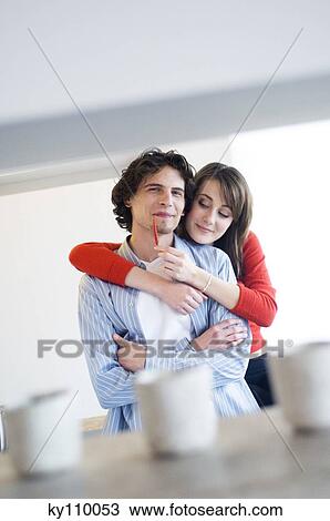 Young couple embracing View Large Photo Image Stock Image - Young couple embracing. Fotosearch