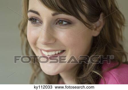 Portrait of a young smiling woman View Large Photo Image Stock Image - Portrait of a young smiling woman. Fotosearch