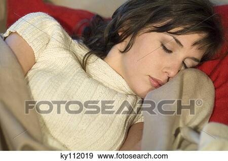 Stock Photo - Young woman sleeping, close-up. Fotosearch