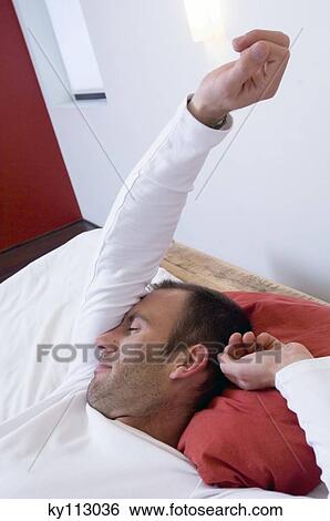 Man streching in bed View Large Photo Image Stock Photograph - Man streching in bed. Fotosearch