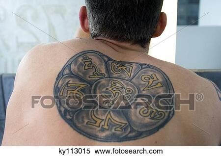 Stock Photography - Tattooed man's back, close-up. Fotosearch