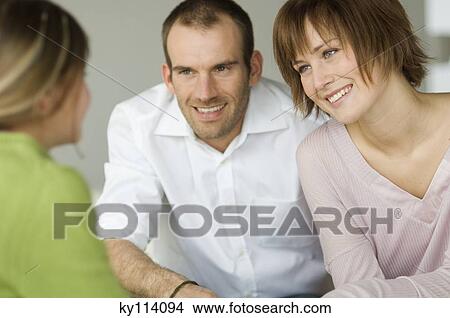 Couple and little girl talking View Large Photo Image Picture - Couple and little girl talking. Fotosearch