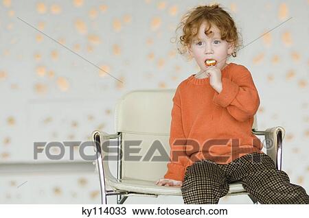Little girl eating lollipop View Large Photo Image Stock Image - Little girl eating lollipop. Fotosearch