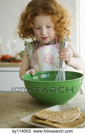 Little girl mixing ingredients in a bowl with a whisk View Large Photo Image Stock Image - Little girl mixing ingredients in a bowl with a whisk. Fotosearch