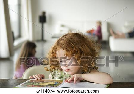 Little girl reading children's book View Large Photo Image Picture - Little girl reading children's book. Fotosearch