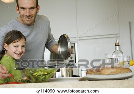 Man and little girl cooking, smiling for the camera View Large Photo Image Stock Image - Man and little girl cooking, smiling for the camera. Fotosearch