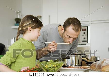 Man and little girl cooking View Large Photo Image Stock Image - Man and little girl cooking. Fotosearch