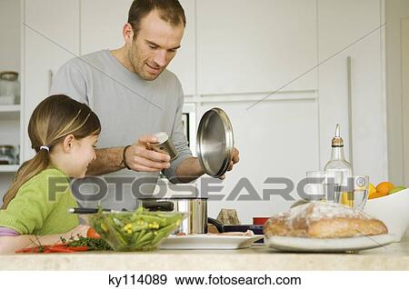 Man and little girl cooking View Large Photo Image Stock Photo - Man and little girl cooking. Fotosearch