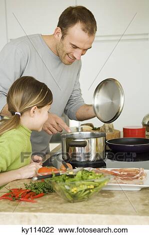 Man and little girl coooking View Large Photo Image Stock Image - Man and little girl coooking. Fotosearch