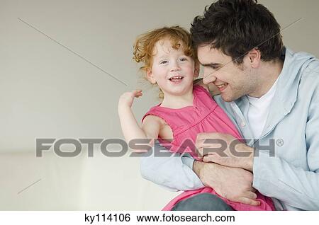 Man and little girl embracing View Large Photo Image Stock Photograph - Man and little girl embracing. Fotosearch