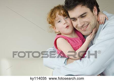 Man and little girl embracing View Large Photo Image Stock Photography - Man and little girl embracing. Fotosearch