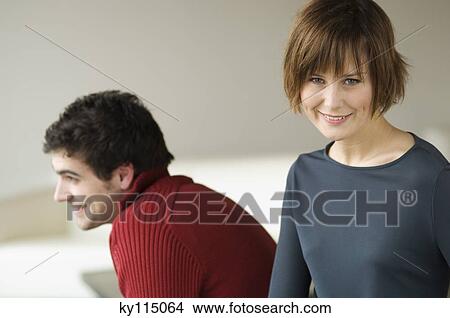 Couple in a living-room View Large Photo Image Picture - Couple in a living-room. Fotosearch