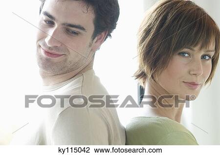 Portrait of a couple, back to back View Large Photo Image Stock Image - Portrait of a couple, back to back. Fotosearch