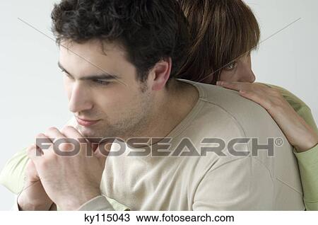 Stock Image - Portrait of a sad looking couple. Fotosearch