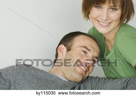 Portrait of a young smiling couple View Large Photo Image Stock Photography - Portrait of a young smiling couple. Fotosearch