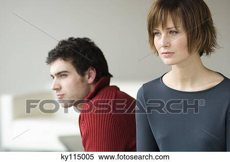 Sad looking couple, interiors View Large Photo Image Stock Photography - Sad looking couple, interiors. Fotosearch