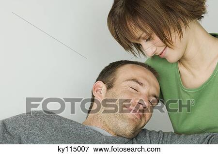 Smiling couple, interiors View Large Photo Image Stock Photo - Smiling couple, interiors. Fotosearch