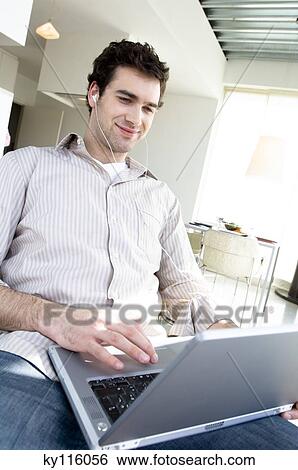 Man using laptop computer View Large Photo Image Stock Photograph - Man using laptop computer. Fotosearch