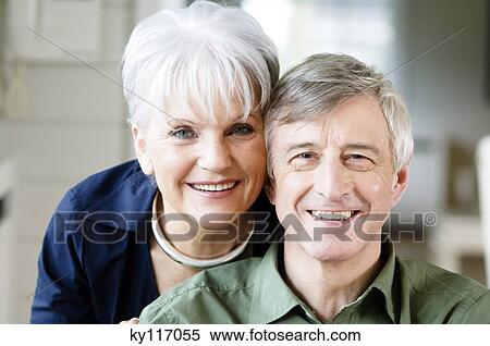 Portrait of a senior couple smiling for the camera View Large Photo Image Stock Photography - Portrait of a senior couple smiling for the camera. Fotosearch