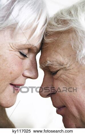 Senior couple face to face, eyes shut, close-up View Large Photo Image Stock Photography - Senior couple face to face, eyes shut, close-up. Fotosearch