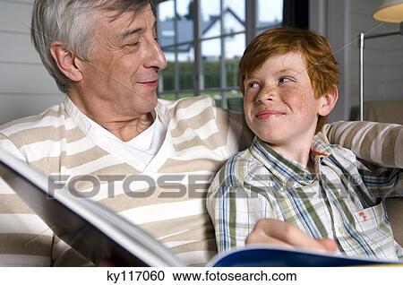 Senior man and boy looking at each other View Large Photo Image Stock Image - Senior man and boy looking at each other. Fotosearch