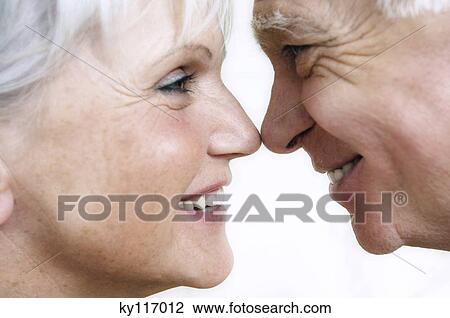 Smiling senior couple face to face, close-up View Large Photo Image Stock Image - Smiling senior couple face to face, close-up. Fotosearch
