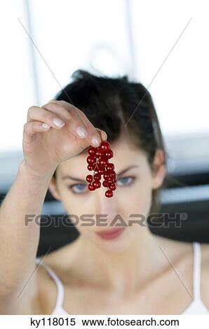 Portrait of a young woman holding redcurrants View Large Photo Image Stock Photography - Portrait of a young woman holding redcurrants. Fotosearch