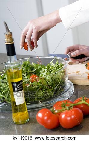 Woman making a salad, close-up View Large Photo Image Stock Photograph - Woman making a salad, close-up. Fotosearch